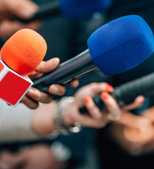 News reporters interviewing a politician.
